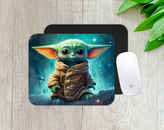 Mouse pad with a character design on a wooden surface with a mouse and plant.